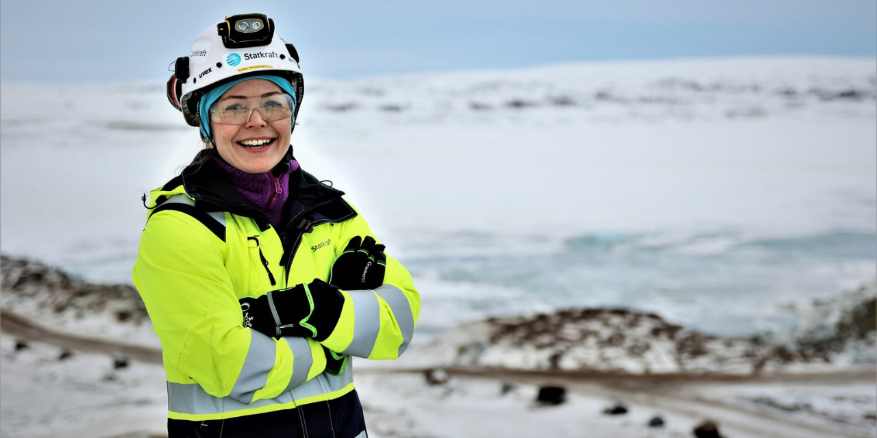Woman wearing safety gear and smiling